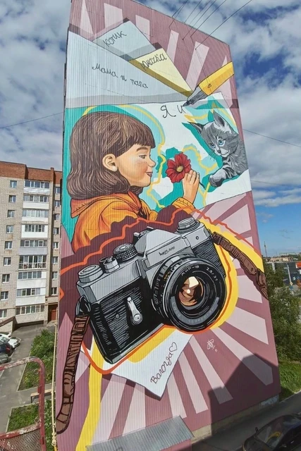 Девочка, кот и фотоаппарат